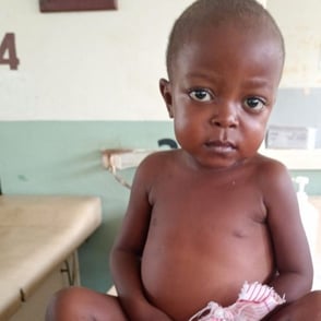 Ugandan child in clinic